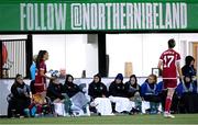 31 October 2023; Northern Ireland substitutes keep warm during the UEFA Women's Nations League B match between Northern Ireland and Hungary at Seaview in Belfast. Photo by Ramsey Cardy/Sportsfile