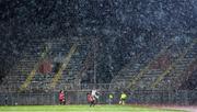 31 October 2023; A general view of the action under heavy rain as Katie McCabe of Republic of Ireland brings the ball forward despite the tackle from Ezmiralda Franja of Albania during the UEFA Women's Nations League B match between Albania and Republic of Ireland at Loro Boriçi Stadium in Shkoder, Albania. Photo by Stephen McCarthy/Sportsfile