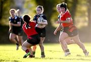 1 November 2023; Muireann Cawley of North Midlands is tackled by Emma Brogan of North East during the BearingPoint Sarah Robinson Cup round two match between North East and North Midlands at Mullingar RFC in Mullingar, Westmeath. Photo by Piaras Ó Mídheach/Sportsfile
