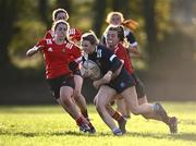 1 November 2023; Laura Walsh of North Midlands is tackled by Anna Dawson of North East, right, during the BearingPoint Sarah Robinson Cup round two match between North East and North Midlands at Mullingar RFC in Mullingar, Westmeath. Photo by Piaras Ó Mídheach/Sportsfile