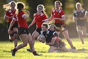 1 November 2023; Laura Walsh of North Midlands is tackled by Anna Dawson of North East during the BearingPoint Sarah Robinson Cup round two match between North East and North Midlands at Mullingar RFC in Mullingar, Westmeath. Photo by Piaras Ó Mídheach/Sportsfile