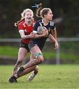 1 November 2023; Elle White of North Midlands is tackled by Alex Connor of North East during the BearingPoint Sarah Robinson Cup round two match between North East and North Midlands at Mullingar RFC in Mullingar, Westmeath. Photo by Piaras Ó Mídheach/Sportsfile