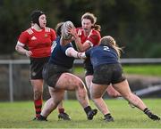1 November 2023; Lillian Brady of North East in action against Clodagh Goulding, left, and Avril Whittle of North Midlands during the BearingPoint Sarah Robinson Cup round two match between North East and North Midlands at Mullingar RFC in Mullingar, Westmeath. Photo by Piaras Ó Mídheach/Sportsfile