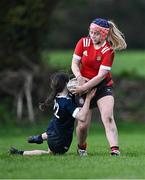1 November 2023; Mia Coan of North East in action against Erin Fitzpatrick of North Midlands during the BearingPoint Sarah Robinson Cup round two match between North East and North Midlands at Mullingar RFC in Mullingar, Westmeath. Photo by Piaras Ó Mídheach/Sportsfile