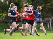 1 November 2023; Chloe Brady of North East is tackled by Ella Murphy of North Midlands during the BearingPoint Sarah Robinson Cup round two match between North East and North Midlands at Mullingar RFC in Mullingar, Westmeath. Photo by Piaras Ó Mídheach/Sportsfile