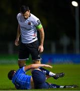 3 November 2023; Patrick Hoban of Dundalk reacts to Eanna Clancy of UCD during the SSE Airtricity Men's Premier Division match between UCD and Dundalk at UCD Bowl in Dublin. Photo by Stephen Marken/Sportsfile