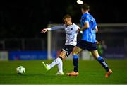3 November 2023; Paul Doyle of Dundalk in action against Ciaran Behan of UCD during the SSE Airtricity Men's Premier Division match between UCD and Dundalk at UCD Bowl in Dublin. Photo by Stephen Marken/Sportsfile