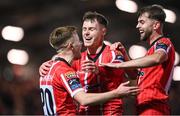3 November 2023; Cameron McJannet of Derry City celebrates with teammates Brandon Kavanagh, left, and Will Patching, right, after scoring their side's first goal during the SSE Airtricity Men's Premier Division match between Derry City and St Patrick's Athletic at The Ryan McBride Brandywell Stadium in Derry. Photo by Ramsey Cardy/Sportsfile
