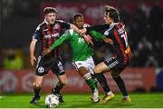 3 November 2023; Malik Dijksteel of Cork City is tackled by James McManus of Bohemians, left, and team-mate Dylan Connolly during the SSE Airtricity Men's Premier Division match between Bohemians and Cork City at Dalymount Park in Dublin. Photo by Tyler Miller/Sportsfile