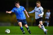 3 November 2023; Eanna Clancy of UCD in action against Daryl Horgan of Dundalk during the SSE Airtricity Men's Premier Division match between UCD and Dundalk at UCD Bowl in Dublin. Photo by Stephen Marken/Sportsfile