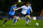 3 November 2023; Connor Malley of Dundalk in action against Danu Bishop of UCD during the SSE Airtricity Men's Premier Division match between UCD and Dundalk at UCD Bowl in Dublin. Photo by Stephen Marken/Sportsfile