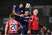 3 November 2023; Cameron McJannet of Derry City in action against David Norman, left, and Chris Forrester of St Patrick's Athletic during the SSE Airtricity Men's Premier Division match between Derry City and St Patrick's Athletic at The Ryan McBride Brandywell Stadium in Derry. Photo by Ramsey Cardy/Sportsfile