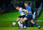 3 November 2023; Cameron Elliott of Dundalk in action against Jack Keaney of UCD during the SSE Airtricity Men's Premier Division match between UCD and Dundalk at UCD Bowl in Dublin. Photo by Stephen Marken/Sportsfile