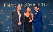 3 November 2023; Fidelma Marrinan of Clare is presented with her TG4 Intermediate Team of the Championship award by Uachtarán Cumann Peil Gael na mBan, Mícheál Naughton, right, and TG4 Head of Sport Rónán Ó Coisdealbha during the 2023 TG4 Teams of the Championship awards night at Croke Park in Dublin. Photo by Sam Barnes/Sportsfile