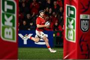 4 November 2023; Rory Scannell of Munster on his way to scoring his side's first try during the United Rugby Championship match between Munster and Dragons at Musgrave Park in Cork. Photo by Eóin Noonan/Sportsfile