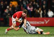 4 November 2023; Seán O'Brien of Munster in action against Jack Dixon of Dragons during the United Rugby Championship match between Munster and Dragons at Musgrave Park in Cork. Photo by Eóin Noonan/Sportsfile