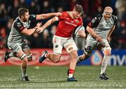4 November 2023; Jack O'Donoghue of Munster is tackled by Ryan Woodman of Dragons, left, during the United Rugby Championship match between Munster and Dragons at Musgrave Park in Cork. Photo by Piaras Ó Mídheach/Sportsfile