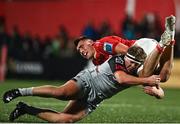 4 November 2023; Brian Gleeson of Munster is tackled by Brodie Coghlan of Dragons during the United Rugby Championship match between Munster and Dragons at Musgrave Park in Cork. Photo by Eóin Noonan/Sportsfile