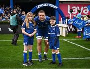 4 November 2023; Leinster captain Scott Penny walks out with matchday mascots Eve Curtin and Eve Curtin, both aged eight, before the United Rugby Championship match between Leinster and Edinburgh at the RDS Arena in Dublin. Photo by Harry Murphy/Sportsfile