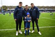 4 November 2023; Match day mascot Oran Malone, aged eight, with Leinster players, from left, Dan Sheehan, Luke McGrath and Ross Byrne before the United Rugby Championship match between Leinster and Edinburgh at the RDS Arena in Dublin. Photo by Harry Murphy/Sportsfile