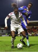 4 November 2023; Wilson Waweru of Cobh Ramblers in action against Roland Idowu of Waterford during the SSE Airtricity Men's First Division Play-Off Final between Waterford and Cobh Ramblers at Turner's Cross in Cork. Photo by Michael P Ryan/Sportsfile