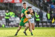 5 November 2023; Gavin Burke of Corofin is tackled by Paul Kelly of Moycullen during the Galway County Senior Club Football Championship final match between Corofin and Moycullen at Pearse Stadium in Galway. Photo by Harry Murphy/Sportsfile