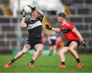 5 November 2023; Iain Corbett of Newcastle West in action against Shane Doherty of Adare during the Limerick County Senior Club Football Championship final match between Adare and Newcastle West at TUS Gaelic Grounds in Limerick. Photo by Tom Beary/Sportsfile