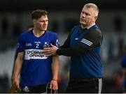 5 November 2023; Cathal McCarthy of Sarsfields is consoled by Sarsfields selector Diarmuid O'Sullivan during the AIB Munster GAA Hurling Senior Club Championship quarter-final match between Ballygunner and Sarsfields at Walsh Park in Waterford. Photo by Eóin Noonan/Sportsfile