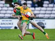 5 November 2023; Dylan Wall of Corofin in action against Conor Corcoran of Moycullen during the Galway County Senior Club Football Championship final match between Corofin and Moycullen at Pearse Stadium in Galway. Photo by Harry Murphy/Sportsfile