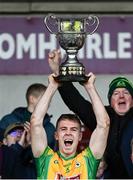 5 November 2023; Corofin captain Dylan McHugh lifts the cup after his side's victory in the Galway County Senior Club Football Championship final match between Corofin and Moycullen at Pearse Stadium in Galway. Photo by Harry Murphy/Sportsfile