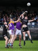 5 November 2023; Anthony Morgan of Kilcoo wins possession from the throw-in against Ryan Jones of Derrygonnelly Harps during the AIB Ulster GAA Football Senior Club Championship round 1 match between Derrygonnelly Harps of Fermanagh and Kilcoo of Down at Brewster Park in Enniskillen, Fermanagh. Photo by Ramsey Cardy/Sportsfile