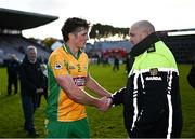 5 November 2023; Kieran Molloy of Corofin is congratulated by a member of an Garda Síochána after his side's victory in the Galway County Senior Club Football Championship final match between Corofin and Moycullen at Pearse Stadium in Galway. Photo by Harry Murphy/Sportsfile