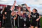 5 November 2023; Wexford Youths captain Freya de Mange, centre, and teammate Siun Murdiff lift the EA SPORTS WU19 Cup after their side's victory in the EA SPORTS Women’s U19 Cup Final between Wexford Youths and Shelbourne at Athlone Town Stadium in Westmeath. Photo by Seb Daly/Sportsfile