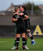 5 November 2023; Wexford Youths players Freya de Mange, left, goalkeeper Claudia Keenan, hidden, and Michaela Lawrence celebrate after their side's victory in the EA SPORTS Women’s U19 Cup Final between Wexford Youths and Shelbourne at Athlone Town Stadium in Westmeath. Photo by Seb Daly/Sportsfile
