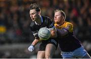 5 November 2023; Ceilum Doherty of Kilcoo is tackled by Leigh Jones of Derrygonnelly Harps  during the AIB Ulster GAA Football Senior Club Championship round 1 match between Derrygonnelly Harps of Fermanagh and Kilcoo of Down at Brewster Park in Enniskillen, Fermanagh. Photo by Ramsey Cardy/Sportsfile