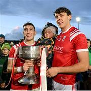 5 November 2023; East Kerry captain Paudie Clifford, left, and brother David Clifford, and David's son Ogie, celebrate with the Bishop Moynihan cup after the Kerry County Senior Football Championship final match between Mid Kerry and East Kerry at Austin Stack Park in Tralee, Kerry. Photo by Brendan Moran/Sportsfile