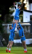 6 November 2023; Joe McCarthy is lifted by Paddy McCarthy, left, and Rory McGuire during Leinster rugby squad training session at UCD in Dublin. Photo by Harry Murphy/Sportsfile
