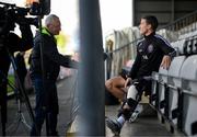 6 November 2023; Injured Bohemians captain Keith Buckley is interviewed by RTÉ's Tony O'Donoghue during a Bohemians media day, at Dalymount Park in Dublin, ahead of the Sports Direct FAI Cup Final. Photo by Stephen McCarthy/Sportsfile