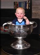 6 November 2023; Rían Whelan, aged 1, with the Sam Maguire Cup during the launch of A Season of Sundays 2023 at The Croke Park Hotel in Dublin. Photo by Piaras Ó Mídheach/Sportsfile