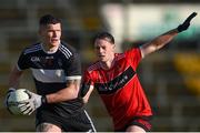 5 November 2023; Iain Corbett of Newcastle West in action against Shane Costello of Adare during the Limerick County Senior Club Football Championship final match between Adare and Newcastle West at TUS Gaelic Grounds in Limerick. Photo by Tom Beary/Sportsfile