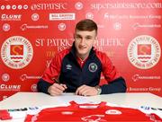 9 November 2023; Mason Melia of St Patrick's Athletic poses after signing his first professional contract, a three year deal, at Richmond Park in Dublin. Photo by Stephen McCarthy/Sportsfile