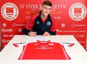 9 November 2023; Mason Melia of St Patrick's Athletic poses after signing his first professional contract, a three year deal, at Richmond Park in Dublin. Photo by Stephen McCarthy/Sportsfile