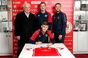 9 November 2023; Mason Melia of St Patrick's Athletic poses with, from left, chairman Garrett Kelleher, manager Jon Daly and director of football Ger O'Brien after signing his first professional contract, a three year deal, at Richmond Park in Dublin. Photo by Stephen McCarthy/Sportsfile