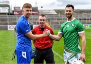21 October 2023; Referee Thomas Gleeson with team captains Roddy McDonald of Scotland and Neil McManus of Ireland before the 2023 Hurling Shinty International Game between Ireland and Scotland at Páirc Esler in Newry, Down. Photo by Piaras Ó Mídheach/Sportsfile