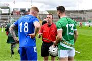 21 October 2023; Referee Thomas Gleeson with team captains Roddy McDonald of Scotland and Neil McManus of Ireland before the 2023 Hurling Shinty International Game between Ireland and Scotland at Páirc Esler in Newry, Down. Photo by Piaras Ó Mídheach/Sportsfile