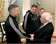 10 November 2023; President of Ireland Michael D Higgins receives 2023 Men's FAI Cup finalist Keith Buckley of Bohemians and manager Declan Devine at Áras an Uachtaráin in the Phoenix Park, Dublin, ahead of the 2023 Sports Direct Men's FAI Cup Final between Bohemians and St Patrick's Athletic to be held on Sunday at the Aviva Stadium in Dublin. Photo by Stephen McCarthy/Sportsfile