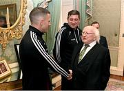 10 November 2023; President of Ireland Michael D Higgins receives 2023 Men's FAI Cup finalist Keith Buckley of Bohemians and manager Declan Devine at Áras an Uachtaráin in the Phoenix Park, Dublin, ahead of the 2023 Sports Direct Men's FAI Cup Final between Bohemians and St Patrick's Athletic to be held on Sunday at the Aviva Stadium in Dublin. Photo by Stephen McCarthy/Sportsfile