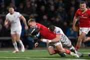 10 November 2023; Craig Casey of Munster dives over to score his side's first try despite the attention of Nick Timoney of Ulster during the United Rugby Championship match between Ulster and Munster at Kingspan Stadium in Belfast. Photo by Ramsey Cardy/Sportsfile