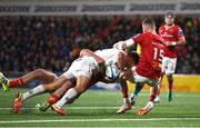 10 November 2023; Ethan McIlroy of Ulster is tackled by Munster players Diarmuid Barron, left, and Shane Daly, who subsequently recevied a yellow card, during the United Rugby Championship match between Ulster and Munster at Kingspan Stadium in Belfast. Photo by Seb Daly/Sportsfile