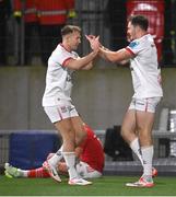 10 November 2023; Jacob Stockdale of Ulster, right, celebrates with teammate Stewart Moore after scoring their side's first try during the United Rugby Championship match between Ulster and Munster at Kingspan Stadium in Belfast. Photo by Seb Daly/Sportsfile